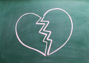 Broken heart on blackboard