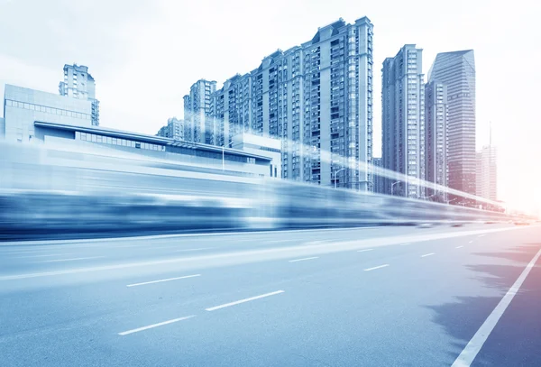 Light trails on buildings background — Stock Photo, Image