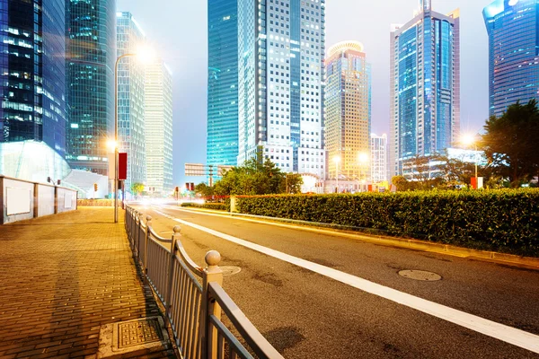 Light trails on buildings background — Stock Photo, Image