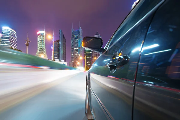 Speeding car go through the city — Stock Photo, Image