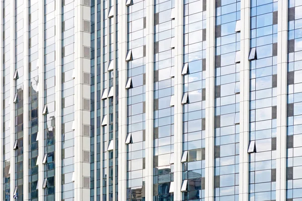 Modern glass silhouettes of skyscrapers in the city — Stock Photo, Image