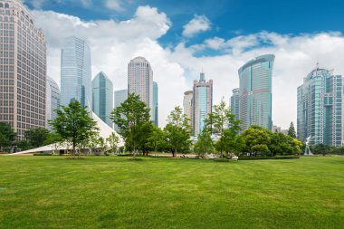 City park with modern building background in Shanghai clipart