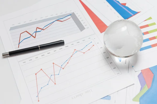 Business presentation with glboe and chart on the desk — Stock Photo, Image