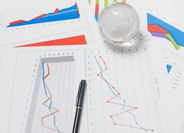 Business presentation with glboe and chart on the desk — Stock Photo, Image