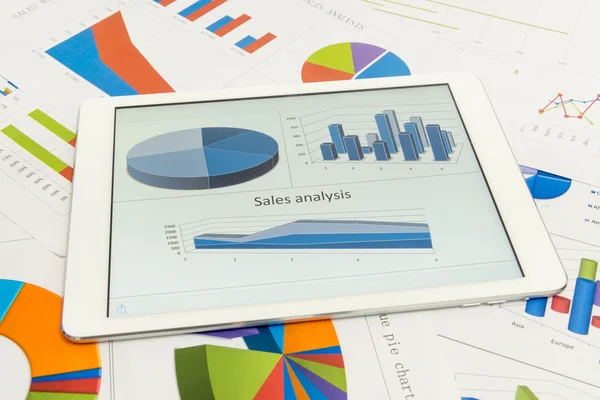 Financial charts with tablet — Stock Photo, Image