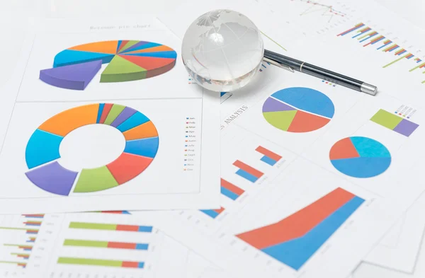 Globe and chart on the desk — Stock Photo, Image