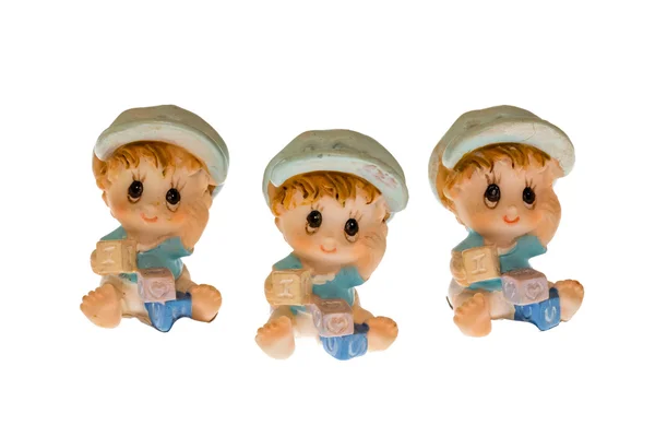 Three children made of porcelain — Stock Photo, Image