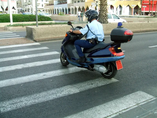 Policeman on a motor scooter — Stock Photo, Image