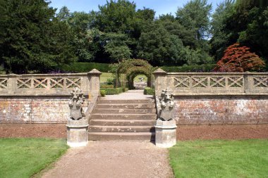 Garden stairway with lion statues with coats of arms