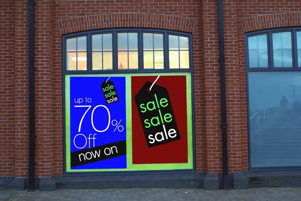 Sale. sign. sale sign. up to seventy percent off now on. on selected lines. store's window — Stock Photo, Image