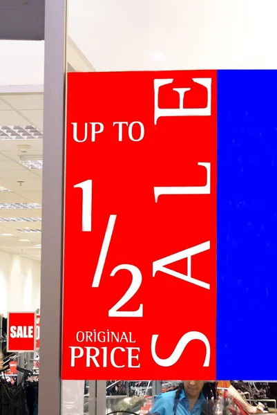 Store's window red sale sign. up to half price. sale. sign. sale sign — Stock Photo, Image