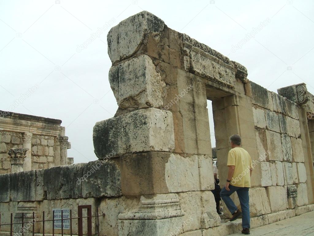 Tourist entering Capernaum synagogue, Galilee, Israel, Middle East