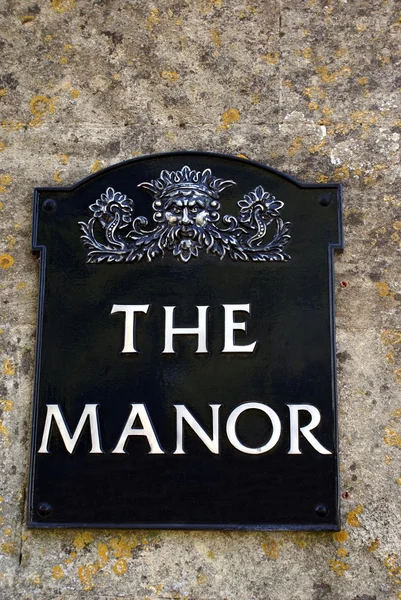 Το σημάδι του Manor. το Manor. Manor — Φωτογραφία Αρχείου