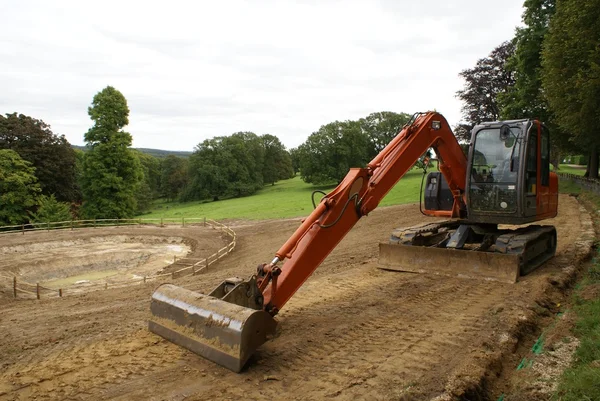 Construction de routes. bulldozer. excavatrice. chantier de construction . — Photo