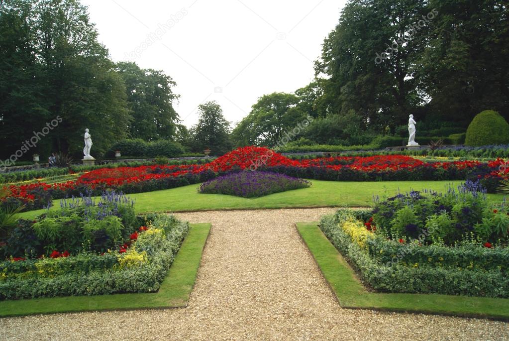 Garden with flower beds and statues