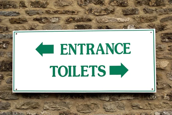 Entrance. toilets. sign. entrance and toilets sign — Stock Photo, Image