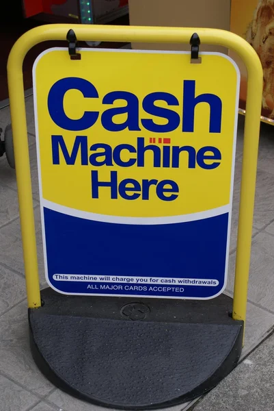 Cash machine here sign. — Stock Photo, Image