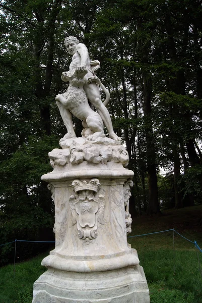 Statue of a man killing a lion — Stock Fotó