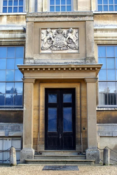 Ornate entrance with coat of arms — Stock Photo, Image