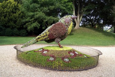 sculpture of a bird at a garden clipart