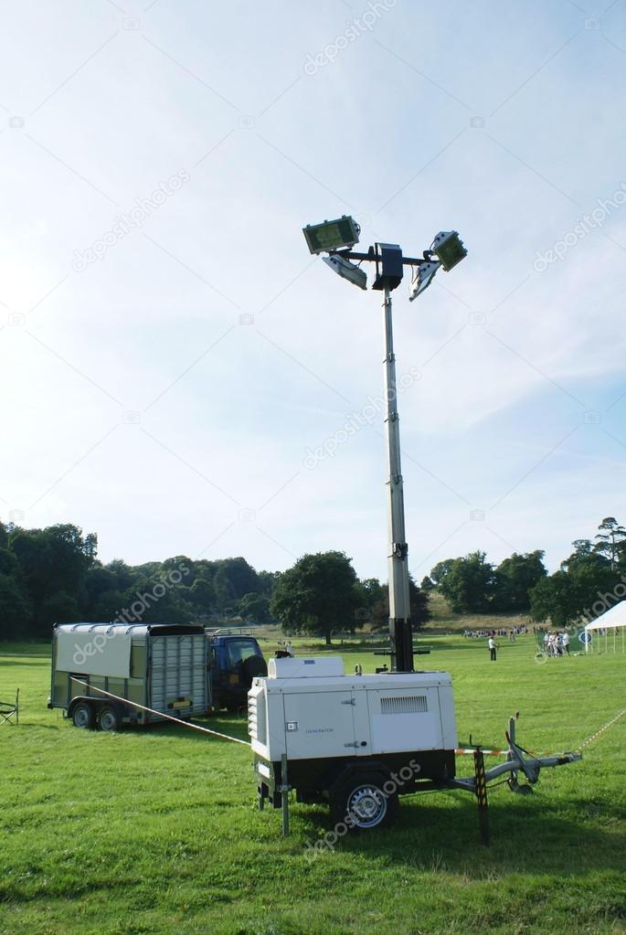 generator and sport lights in a field or a park