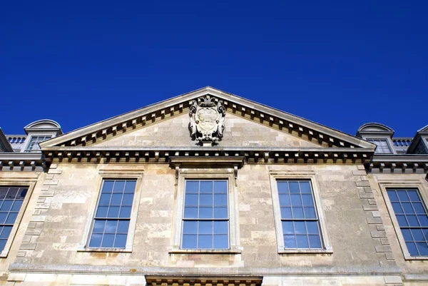 Front gable with a coat of arms — Stock Photo, Image