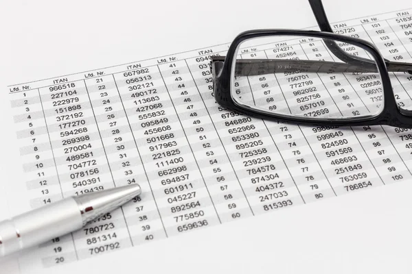 Glasses, ballpoint pen and TAN list for online banking — Stock Photo, Image