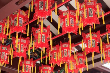 Closeup of red chinese lanterns in buddhistic temple in chinatown, Singapore clipart