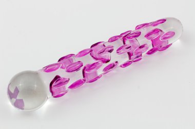 Sex Toy - Isolated Glass dildo with pink knobs and white background