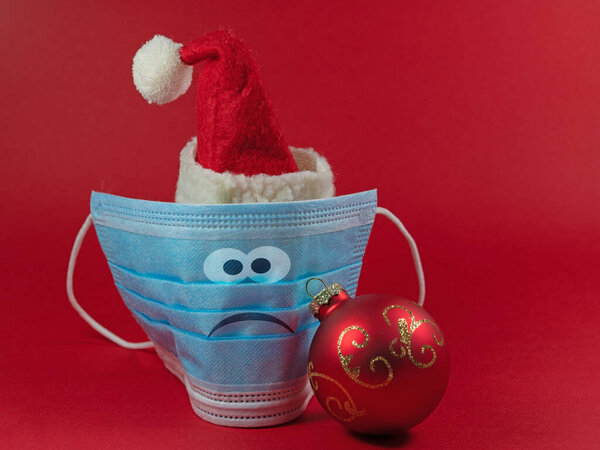 Face mask with Santa Claus hat and face in a bad mood
