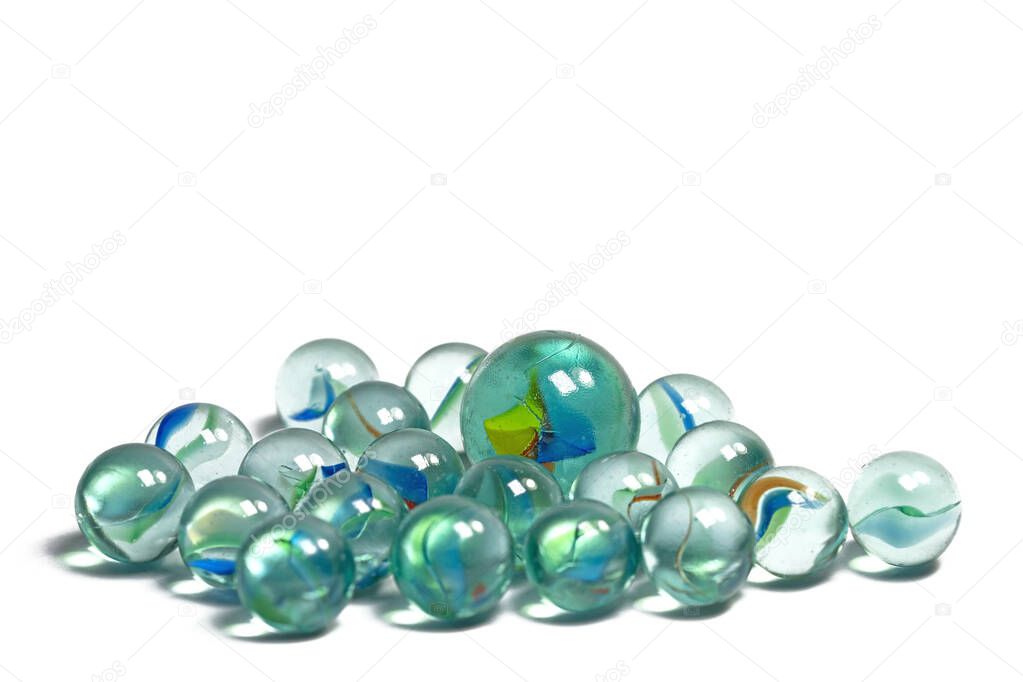 Lots of colorful glass balls against a white background