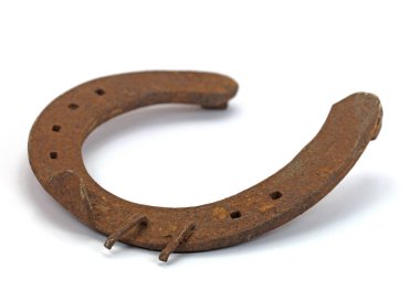 Old rusty horseshoe in close up