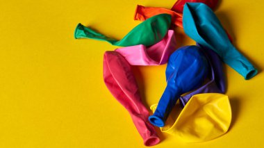 enchanting balloons are scattered on a yellow background