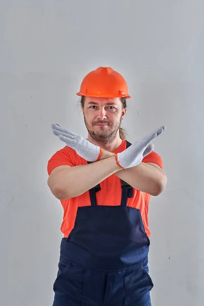 On a white background in bright overalls man — Stock Photo, Image
