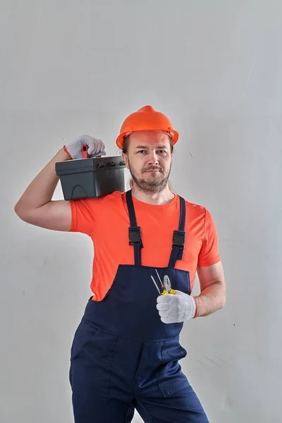 Professional electrician with a light tool case — Stock Photo, Image