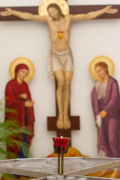 Church and the interior, a cross and candles — Stock Photo, Image