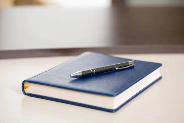 Colorful pan with notebook — Stock Photo, Image