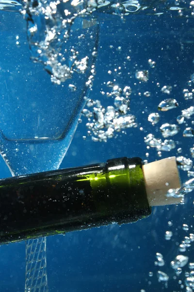 Bottle neck on water with bubbles — Stock Photo, Image