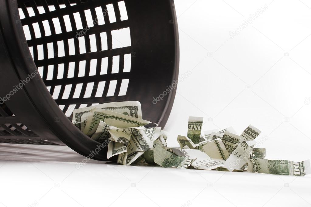 Money in the garbage can with clipping path