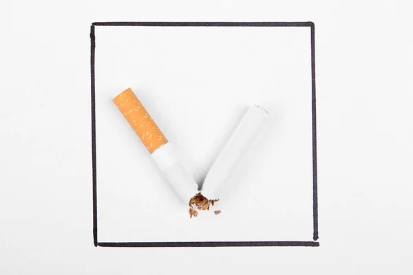 Broken cigarette like tick mark. Stop smoking concept. — Stock Photo, Image