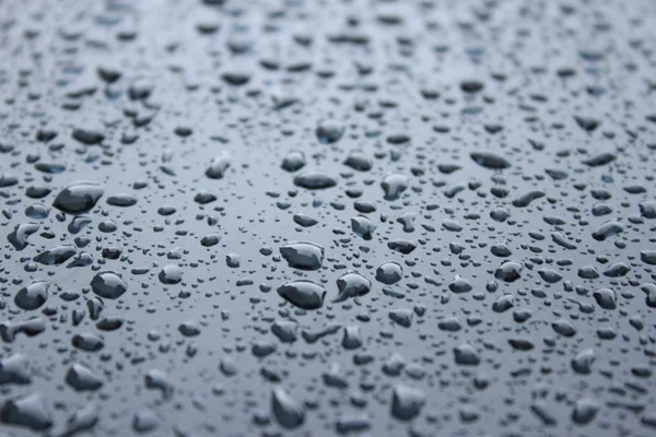 Water drops on metal surface. Abstract background