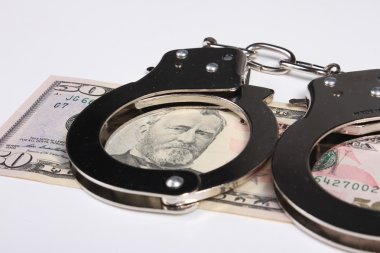 Suçlu. Kelepçe ve para. Bozulması