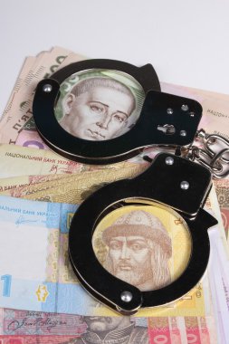 Suçlu. Kelepçe ve para. Bozulması