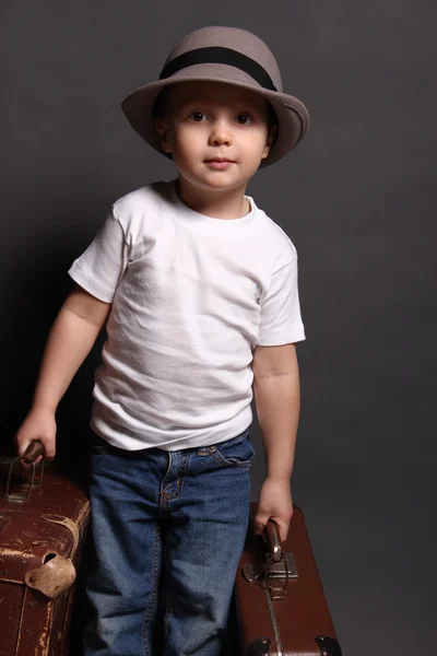 Boy in hat with bag