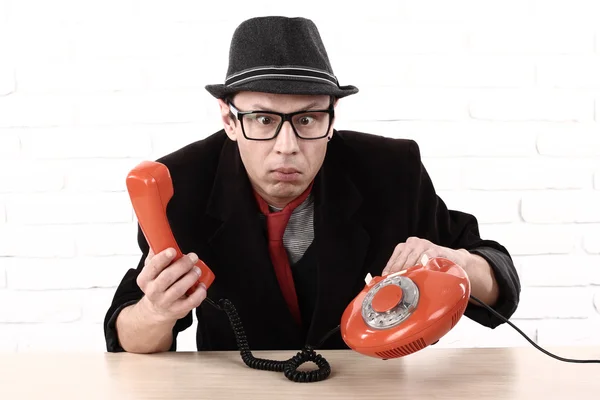 Disappointed handsome, angry, man showing old phone, do non know how to use it — Stock Photo, Image