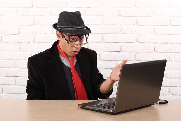 Shocked young business man using laptop looking at computer screen blown away in stupor sitting outside corporate office. Human face expression, emotion, feeling, perception, body language, reaction — Stock Photo, Image
