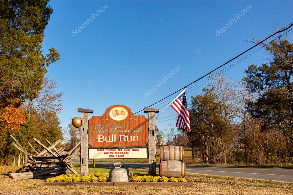 Manassas, VA, USA 11-14-2020: Winery at Bull Run is a local vineyard located by Lee Highway near the historic Manassas National Battlefield site. American flag and a few wine barrels are by the sign.