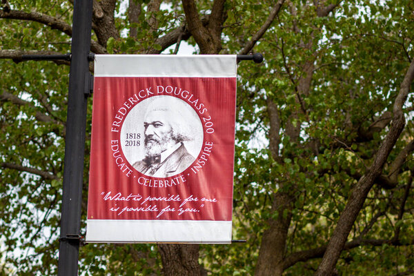 04-16-2021 Easton, MD, USA: Banner commemorating the famous reformist abolitionist African American leader Frederick Douglass, near Talbot County Courthouse, where he was once kept as a prisoner.