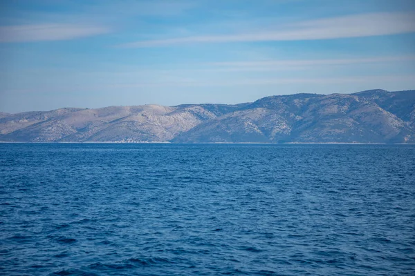 View from water of rocky shore of island in Croatia — Stock Photo, Image