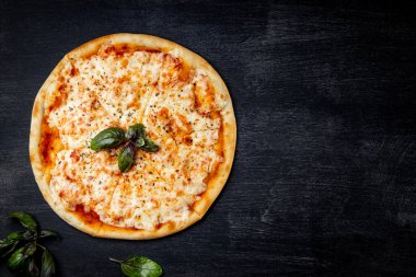  Italian pizza margarita on black background, top view, free space for text. High quality photo clipart